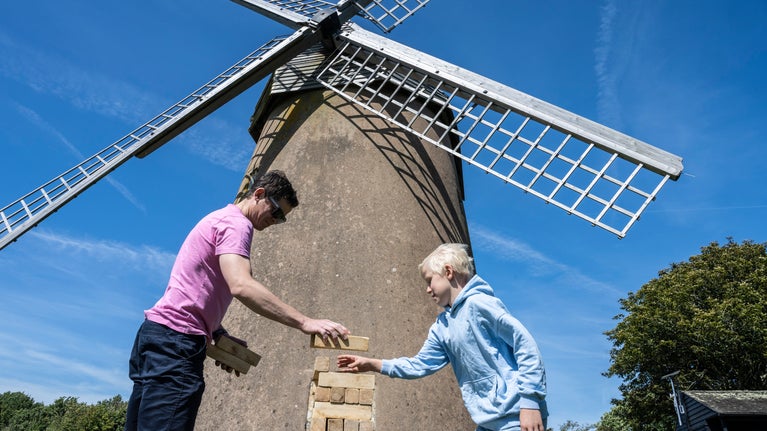 Family playing a block game at Bembridge Windmill